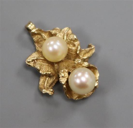 A 14ct gold and cultured pearl set pendant, 22mm.